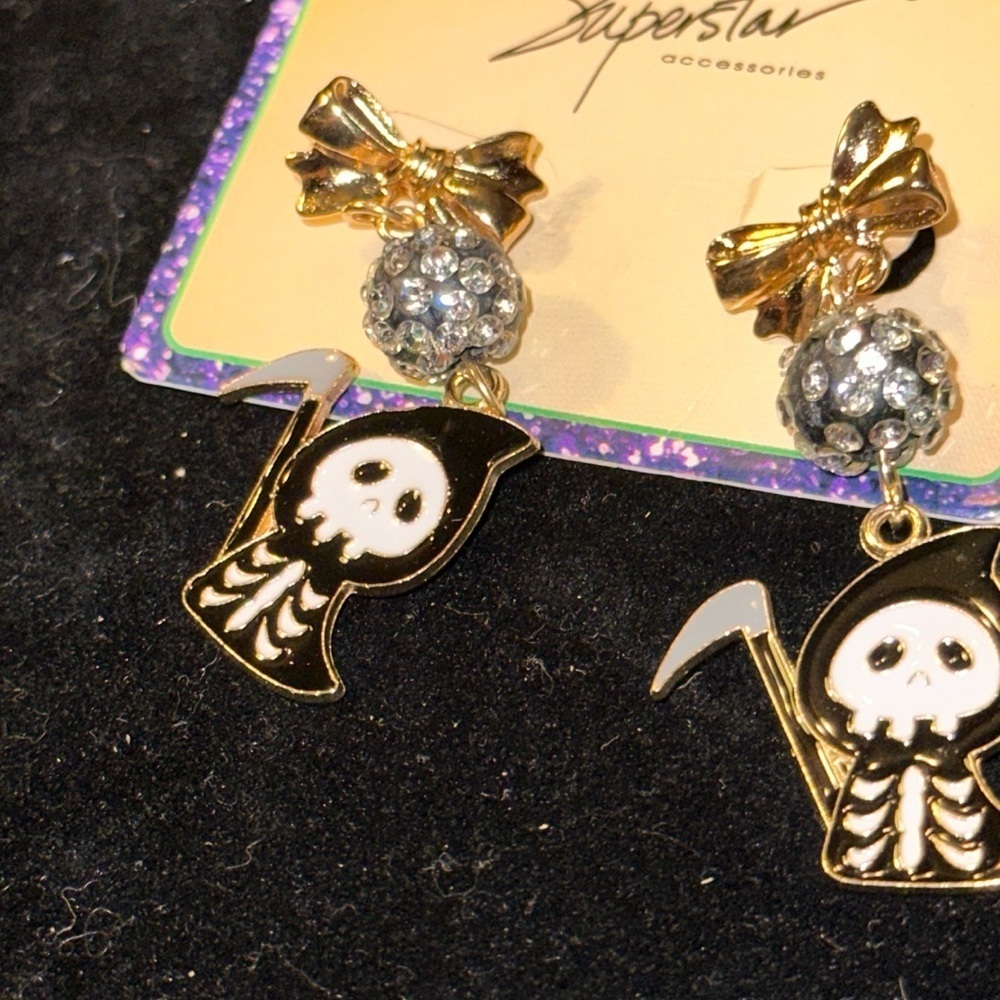 Halloween pierced earrings. The Grim Reaper. They are adorable.​​